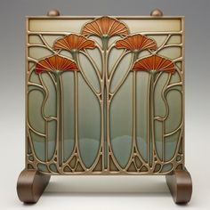 an art deco style glass panel with flowers on the front and sides, set against a white background