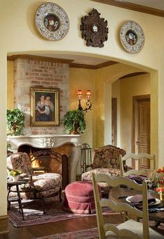 a living room filled with furniture and a fire place