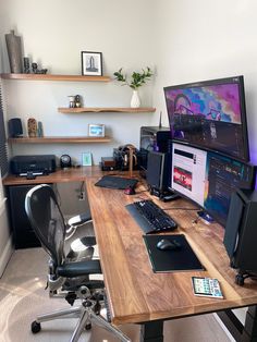 a computer desk topped with two monitors and a keyboard