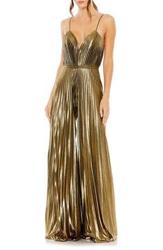 Enter your next special event in a disco-chic manner with this crisp, accordion-pleated jumpsuit styled with flowy wide legs, slender straps and a banded waist. 61" length; 31 1/2" inseam; 136" leg opening (size 8) Plunge neck Spaghetti straps Partially lined 100% polyester Spot clean Imported Asian Owned/Founded Pleated Jumpsuit, Formal Jumpsuit, Mac Duggal, Jumpsuit Fashion, Gold Dress, Fashion Fabric, Wide Leg Jumpsuit, Antique Gold