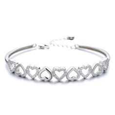 The Sterling Silver and Swarovski Crystal Hearts Bangle Adjustable Bracelet is not only beautiful and delicate but also very comfortable. With minimal design, it can be worn every day, to go out or just around the house. This accessory makes gracefulness and elegance perfect for a special occasion where you want to look good and elegant. Wear our Sterling Silver Bracelet for a unique accessory for your wardrobe! Made from high-quality materials and extra durable, this piece will last long. It's hypoallergenic, lead, and nickel free so it's safe for sensitive skin to wear. Whether you are looking for a simple accessory or something more elaborate, this Hearts Bangle bracelet will become a cherished piece within your jewelry collection. Makes a great gift for your sister, daughter, granddaug Luxury Silver Heart-shaped Bracelets, Cheap Crystal Bangle Bracelets, Cheap Crystal Bangle Bracelet, Luxury Silver Heart Bracelet, Luxury Sterling Silver Crystal Bracelet As Gift, Luxury Silver Bracelet Gift For Her, Cheap Silver Crystal Bracelets, Cheap Trendy Silver Crystal Bracelet, Cheap Silver Crystal Bracelet