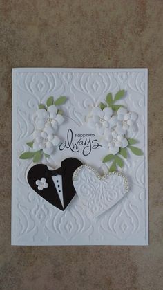 a card with flowers and a suit on it