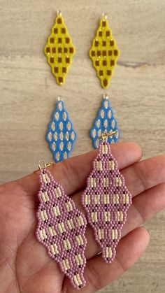 This listing is for a digital pattern of my original brick stitch beaded earring pattern called Ceres. The main pattern is for the purple and white earring but the bead colors for the other two colorways are also included. Your purchase does NOT include instructions or supplies, but you can find tutorials for Brick Stitch on ton my YouTube channel, https://www.youtube.com/@snailsandfairydust The finished size of one earring is 2.5 x 1 inches, and this pattern was designed for size 11 Miyuki Delica seed beads, which is what I recommend for best results. However, if you use different beads, please note that the sizing will vary. With your purchase, you will receive a 3-page PDF with the exact bead count needed as well as the product numbers for the specific size 11 Delica beads used in 3 dif Brick Stitch Earrings Pattern, Brick Stitch Pattern Earring, Seed Bead Patterns Free, Bead Jewelry Patterns, Seed Bead Jewelry Patterns, White Earring, Brick Stitch Earrings, Brick Stitch Pattern, Beaded Earring