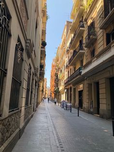 an empty city street lined with tall buildings