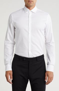 Serve easy stylish looks in this core button-up shirt cut in slim silhouette from pure cotton. Front button closure Spread collar Long sleeves with adjustable button cuffs 100% cotton Machine wash, tumble dry Imported Party Inspo, White Button Up, Nordstrom Store, Cut Shirts, Mens Shirt Dress, Nordstrom Rack, Pure Cotton, Button Up Shirts, Tommy Hilfiger