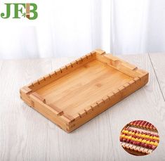 a wooden tray that has some food on it