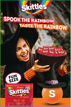 an advertisement for skittles with a witch holding up a hat and candy bar