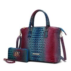 Introducing our exquisite Frankie Satchel Bag, a fusion of bold style and practical design. This Satchel is crafted from luxurious faux gradient rainbow crocodile-embossed material, offering a vibrant and unique texture that adds a striking touch to any ensemble. The bag features a secure top zipper closure, ensuring your belongings stay safe and easily accessible. Inside, you will find a thoughtfully organized space with two slip pockets ideal for your phone and small accessories and a wall zip Vibrant Aesthetic, Slider Necklace, Wallet Craft, Fancy Necklace, Bold Style, Market Tote, Practical Design, Zippered Tote, Cute Purses