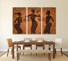 three paintings on the wall of a dining room