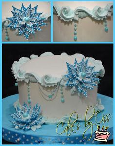 the cake is decorated with blue frosting and snowflakes on it's sides