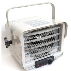 an electric heater sitting on top of a white table