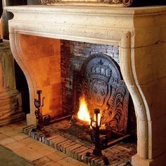 a fireplace with a mirror on top of it