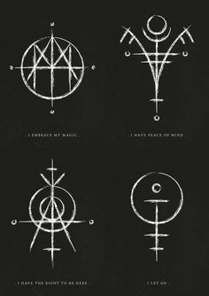 four different types of symbols drawn on black paper