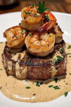 a steak with shrimp and shrimp on top