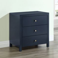 a blue nightstand with two drawers in front of a white wall and hardwood flooring