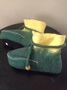 dFair Trade item from craft artisans in Nepal, famous for their wet felting culture. They use sheep wool and turn it into felt through handling and hot, soapy water.  The slippers are green and yellow. The cuff is folded down but they look cool as a boot. Suede soles. Your own foot will determine left or right. A little stiff to start but if you wet them a little or slide a wet foot in, it will adapt to your foot and be very comfortable.  I sold these in my brick and mortar fiber arts shop but closed it and need to get these out of storage.  Sizes: Please select which you want.  22 cm -Child Foot size in INCHES 8.66 24 cm - Foot Length in INCHES 9.45 26 cm Foot Length in INCHES 10.25 These are unisex so don't want to stipulate men/women. But, as a female wearing 7.5 US shoe, the 24cm were Elf Slippers, Christmas Handmade, Brick And Mortar, Wet Felting, Fiber Arts, Soapy Water, Sheep Wool, Look Cool, Halloween Christmas