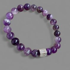 Victoria Grig Women's bracelet made of natural amethyst stone. Polished amethyst bead stretch bracelet. 🌟Amethyst beads size - 8 mm. 🌟Bracelet size can be - 16,17,18 cm./6.3, 6.7, 7.0 inches. 🌟Insertable bead with cubic zirconia, rhodium plated. 🌟Bracelet without clasp. Stretches, easy to put on and take off. Amythest Bracelet, Purple Beaded Bracelets, Purple Bracelet, Amethyst Bracelet, Amethyst Beads, Jewelry Boho, Beaded Stretch Bracelet, Chic Fashion, Amethyst Stone