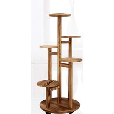 the cat tree is made from wood and has three shelves on each side, one with two