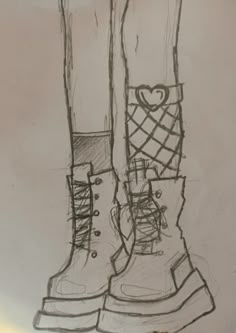 a drawing of two boots with hearts on the boot and one has a shoelace