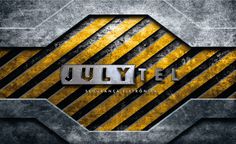 the title for july, written in black and yellow stripes on a metal background with metallic letters