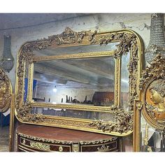 an ornately decorated dresser and mirror in a room