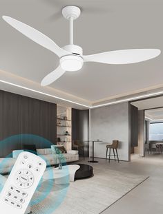 a living room with a ceiling fan and remote control