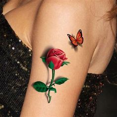 a woman's arm with a rose and butterfly tattoo on the left side of her arm