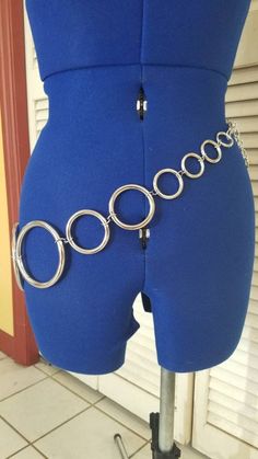 "This belt consists of 15 steel rings ranging from 3.5\" to .75\" with a large 1.5\" lobster clasp and 6 inches of chain. It has an overall length of 38\" and a minimum length of 27\". It can be worn several different ways, even as a necklace. The large clasp can connect to and link in the chain, any of the first four smaller rings or to any of the connecting jump rings. You can adjust it to fit high on your waist or low on your hips. If you would like a larger or smaller version just let me kno Ring Belt, Cow Bell, Cute Necklace, Small Rings, Steel Ring, Jump Rings, Ring Necklace, Lobster Clasp, 6 Inches