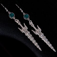 "TRIBAL SWORD" Fantasy EARRINGS : these medieval inspired earrings are made of faceted emerald green crystals and two heroic fantasy swords / These earrings are intended for pierced ears and they measure 9 cm height ( 3,5 inches ) / WORLDWIDE delivery : all shipments are provided with tracking / FREE Worldwide SHIPPING on all Orders over 130 € with Coupon Code : ONLYFORYOU Fantasy Emerald Earrings, Handmade Medieval Metal Earrings, Medieval Jewelry Earrings, Swords Earrings, Fantasy Earrings, Dragon Jewelry Jewelry1000.com, Fantasy Role Playing, Heroic Fantasy, Green Crystals