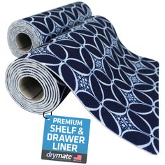 a blue and white tie with black circles on it, next to a tag that says premium shelf & drawer liner