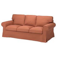 an orange couch sitting on top of a white floor