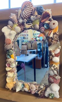 there is a mirror made out of seashells