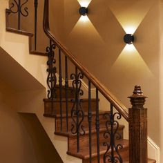 a stair case with two lights on each side