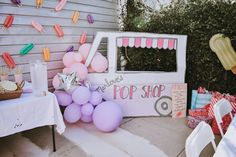 an ice cream truck decorated with balloons and confetti for a birthday or baby shower