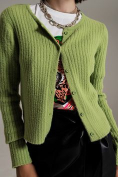 Wrap yourself in comfort and style with our Green Super Soft Fluffy Knit Cardigan. This cardigan features a luxurious and soft fluffy knit design, perfect for staying warm and fashionable. Crafted from 100% polyamide, it offers a cozy and lightweight feel. With a bodycon fit and 3/4 length sleeves, it provides a trendy and flattering silhouette. The button placket adds a touch of elegance and functionality to the cardigan. Whether for a party or a casual outing, this green fluffy knit cardigan e