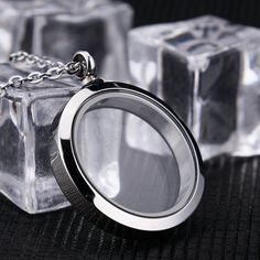 a magnifying glass sitting on top of an ice block with chains around it