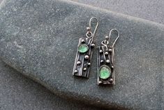 Elegant earrings that are designed to be passed down for generations to come! Features a silver base with blackened textured detailing and man grown light green corundum gemstone. With a color that complements every metal, my quartz earrings are crafted in sterling silver, designed and crafted by hand using techniques of sawing, hammering, soldering and oxidizing.  Height with hook 48mm These earrings will come delivered in a lovely wooden box. Hopefully, this piece of work will find somebody that will love it as much as I do!  This special earrings can be a great gift for your beloved one or for yourself. All my items are shipped with tracking number. Metal Jewelry Handmade, Silversmith Jewellery, Diy Jewelry Earrings, Soldering Jewelry, Jewelry Making Earrings, Earrings Inspiration, Handcrafted Artisan Jewelry, Tree Bark, Black Earrings