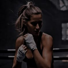 a woman with boxing gloves on her hands