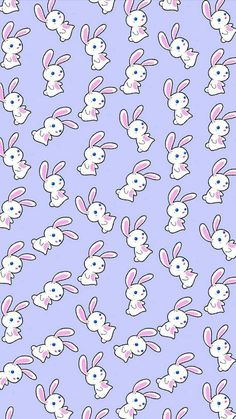 an image of many rabbits with blue eyes and pink ears on purple background, all in the same pattern