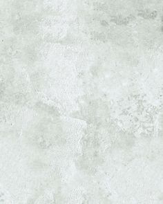 an image of a white concrete wall textured with light gray paint or cement stains