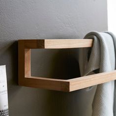 a towel rack is mounted on the wall