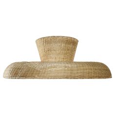 a large straw hat sitting on top of a table