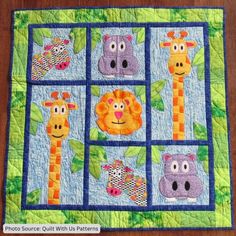 a quilted wall hanging with animals on it