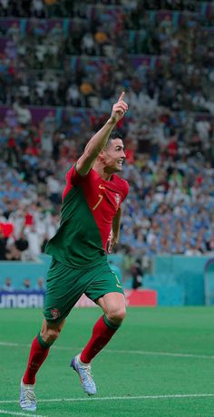 the soccer player is celebrating his team's victory over the opponent in front of an audience