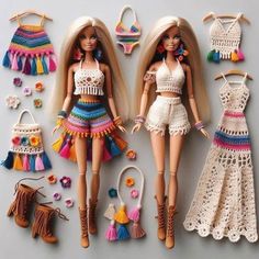 two barbie dolls are posed next to crocheted dresses and purses