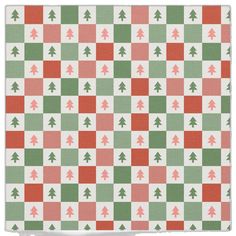 a checkered pattern with christmas trees on the side and red, green, and white squares