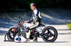 a man riding on the back of a motorcycle