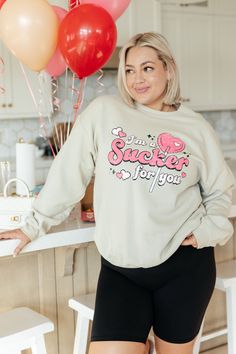 Bring some fun and playfulness to your closet with our I'm A Sucker For You Valentine Pullover. This unisex sweatshirt flaunts a ridiculously cute graphic print that will have you standing out in the crowd. Perfect for adding a quirky twist to your Valentine's Day look. Sweatshirt Fleece Crew Neckline Long Sleeved Unisex Fit 50% Cotton, 50% Polyester True to Size S: Chest 40" Length 26"M: Chest 44" Length 27"L: Chest 46" Length 28"XL: Chest 52" Length 30"2XL: Chest 54" Length 30"3XL: Chest 58" L