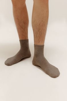 Everyday low-profile minimalist socks with one purpose: keeping your feet warm & cozy. Our Men’s Mid-Calf Socks come in a convenient value pack (perfect for stocking your own sock drawer or as a practical gift for loved ones). Details Materials & Care Shipping & Returns • Mid-calf socks in easy-to-match colors. Each pack includes three pairs of socks.• Made from a comfortable, antibacterial blend of cotton & Spandex that keeps skin clean, dry, and healthy.• Easy care: durable & machine washable. Comfortable Cotton Socks For Streetwear, Ankle Socks Outfit, Warm Socks For Men, Affordable Classic Men's Socks, Mens Warm Winter Socks, Classic Affordable Men's Socks, Tan Shoes, Sock Drawer, Sock Outfits