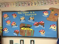 a bulletin board with pirate themed items on it in a classroom setting for children to learn